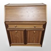 A Sutcliffe teak bureau,