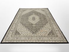 A Tabriz carpet, Iranian Azerbaijan, the black central Herati field with cream pole medallion,