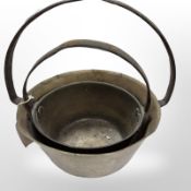 Two 19th century brass jam pans with cast iron handles,