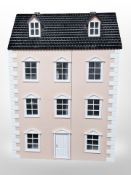 A Georgian style three storey doll's house,