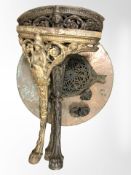 A Britannia style cast iron pub table with hammered copper top (dismantled)