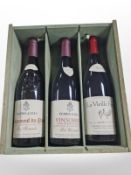 Two bottles of Perrin and Fils wine and further bottle of La Vielle Ferme wine in pine crate