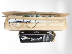 An LED light bar, together with a No Fear folding scooter and a Christmas tree, in box.