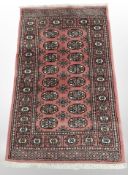 A Lahore Bokara rug, Pakistan, The salmon field with two columns of guls,
