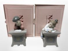 Two Nao figures of children studying, No. 1403 and 1404, both with original boxes.