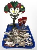 A brass and stained glass Tiffany-style table lamp,