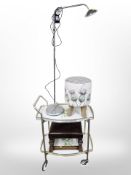 A vintage two tier drinks trolley, oak framed stool, a contemporary stool and a chrome lamp.