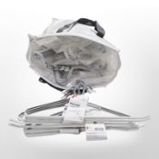 A large quantity of metal trouser hangers