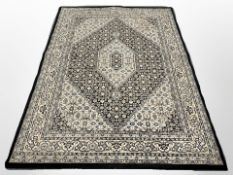 A Tabriz carpet, Iranian Azerbaijan, the black central Herati field with cream pole medallion,