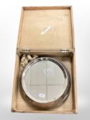 A silver plated mirrored wedding cake stand, in pine crate.