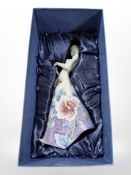 Seven matching Old Tupton Ware pottery figures of ladies in floral dresses, height 26cm, all boxed.