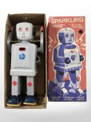 A Schylling Sparkling Mike walking tin robot roy, in original box.