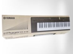 A Yamaha Piaggero NP-32B digital keyboard in box