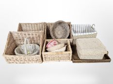 Thirteen various wicker baskets and trays,