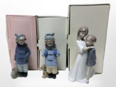 Three Nao figures of children, No. 1568, 1036 and 1038, all with original boxes.