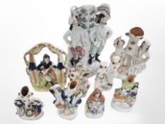 Nine Victorian Staffordshire figures and groups, tallest 35cm.