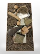 A heavily carved oak mirror, length 55cm, together with a group of wooden butter stamps,