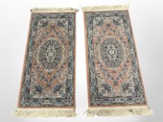 A pair of machine-made Iranian style rugs,