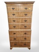 A 20th century walnut eight drawer tall boy,