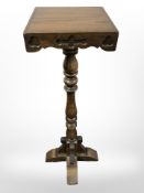A reproduction oak Gothic style jardiniere stand,