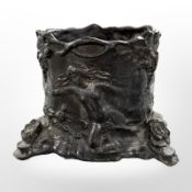 A cylindrical cast bronze desk stand, height 10cm.