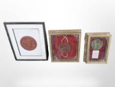 Two framed wax seals and a further metal seal of Henry VIII,