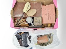 A vintage leather luggage case, a quantity of purses and wallets, vintage tins, shoe trees, camera,