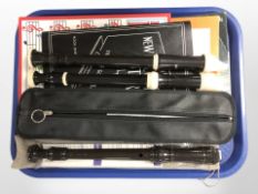 A Yamaha recorder, Dolmetsch recorder and one other, with accompanying sheet music.