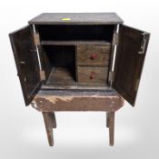 A 19th century pine cracket and a small oak cabinet