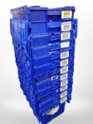 Twelve stackable plastic storage boxes with folding lids,