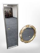 A silvered rectangular mirror,