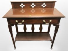 A mahogany single drawer side table,