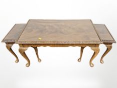 A reproduction nest of three mahogany tables,