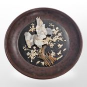 A Japanese shibayama panel, in lacquered circular frame,