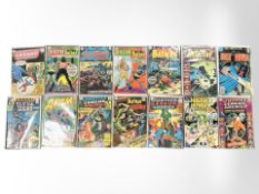 An assortment of DC comics, including The Atom, Batman, Suicide Squad, Justice League of America,