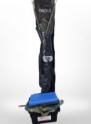 A Shakespeare fishing rod bag containing various rods, landing net,