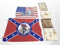 A group of cushions, wall hanging depicting a sailing ship, two American flags,