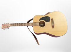 A Sigma Guitars DM1S acoustic guitar.