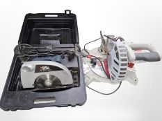 A Performance 210mm compound mitre saw and a Black and Decker KS865 circular saw in box.