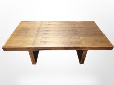 A modern stained hardwood rectangular dining table, 200 cm x 100 cm x 75 cm.