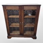 A New Plan Furniture glazed oak double door bookcase,