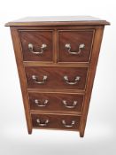 A reproduction five drawer chest, 51 cm x 42 cm x 90 cm.