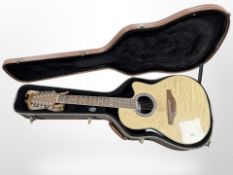 An Ovation Celebrity CC045 electro acoustic guitar, with a guitar hard carry case.