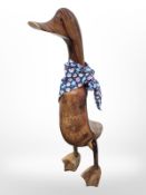 A wooden figure of a duck,