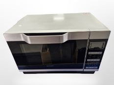 A Sharp stainless steel microwave.