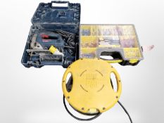 A Bosch jigsaw in case, a Stanley tool chest and a Power Pod power outlet.