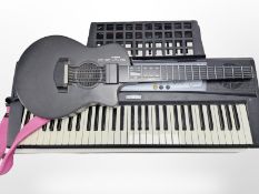 A Yamaha EZ-AG digital headless guitar,