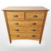 A modern pine five drawer chest, 82 cm x 40 cm x 86 cm.