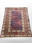 A Kazak rug, 135 cm x 100 cm.