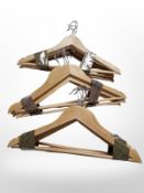 A quantity of wooden clothes hangers.